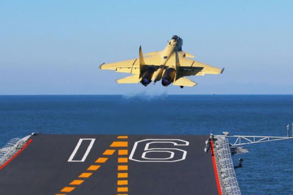 A J-15 jet takes off from China's aircraft carrier, the Liaoning, as part of tests that saw the fighter-bomber make the first successful landing on deck. Xinhua said more than 100 training exercises had been completed on the carrier since it was formally commissioned to the navy on September 25. Photo: Xinhua