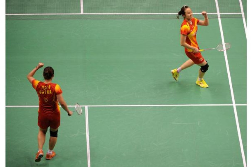 Tian Qing (left) and Zhao Yunlei (right) of China celebrate after beating Wang Xiaoli and Yu Yang in the women's doubles. Photo: AFP