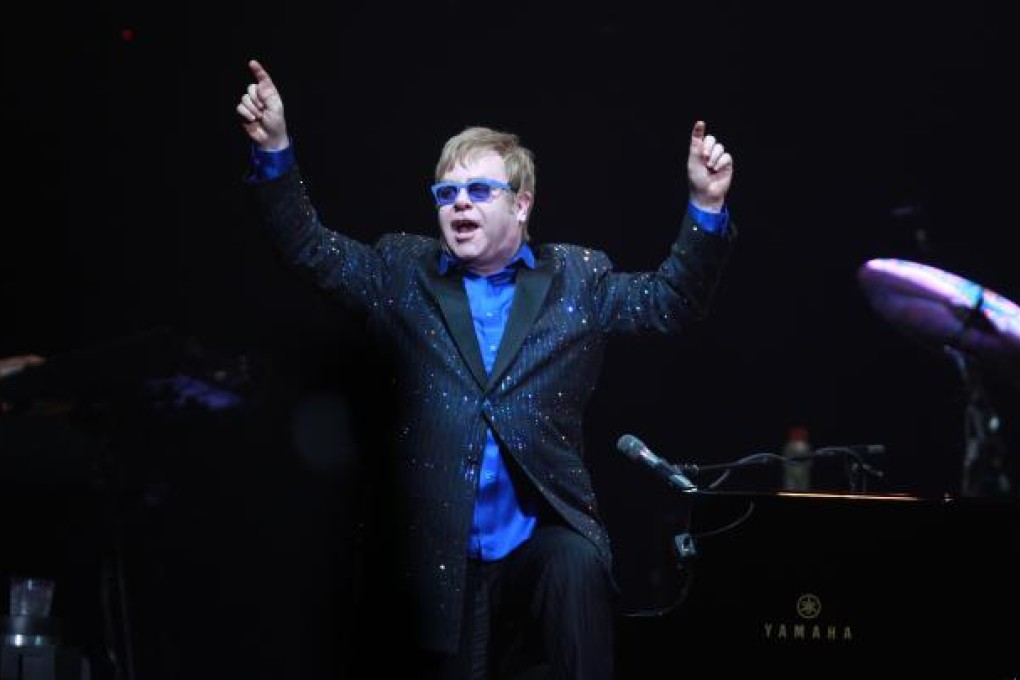 Elton John performs with his band in Beijing on Sunday. Photo: Xinhua