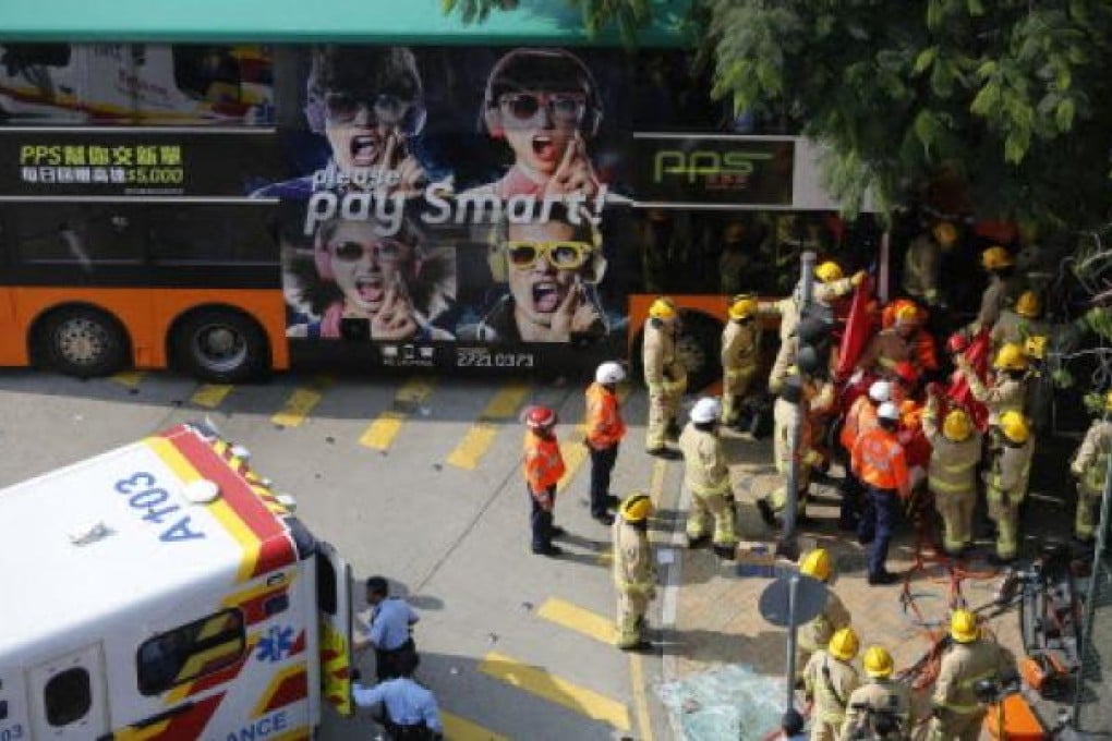 Rescuers work at the site where a double decker bus crashed with two other vehicles at Shau Kei Wan last week. Photo: Xinhua