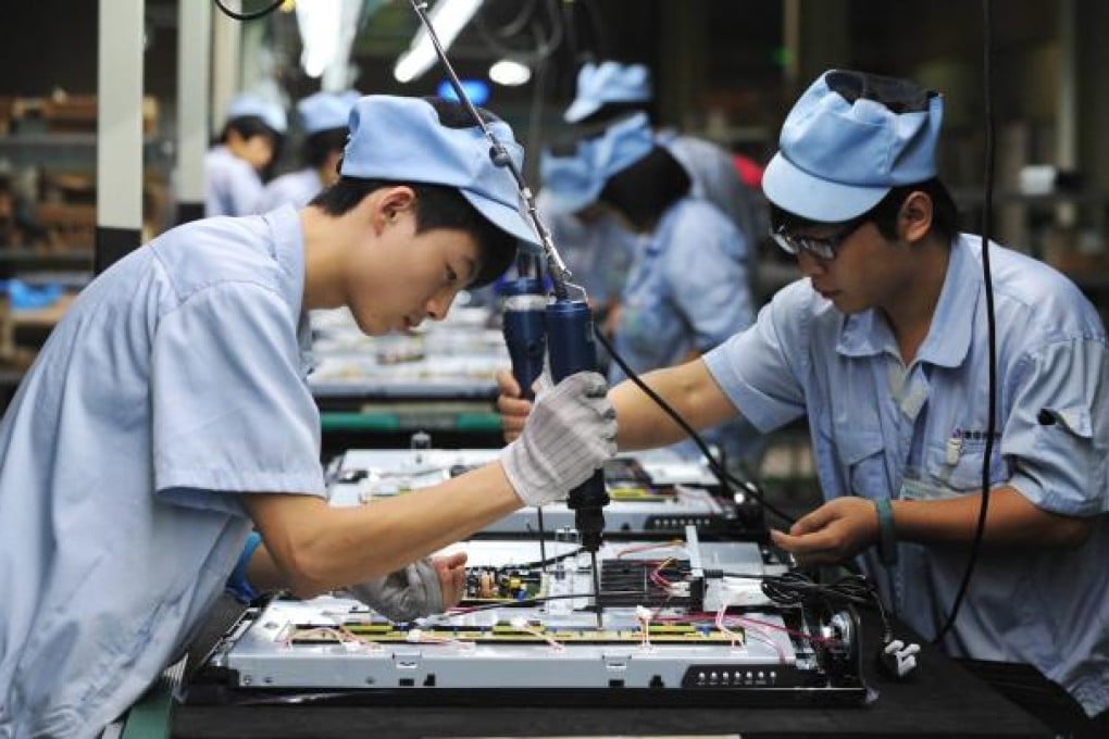 Chinese workers labouring on a television set assembly line in a factory in Shenyang in Liaoning Province on August 27, 2012. Photo: EPA