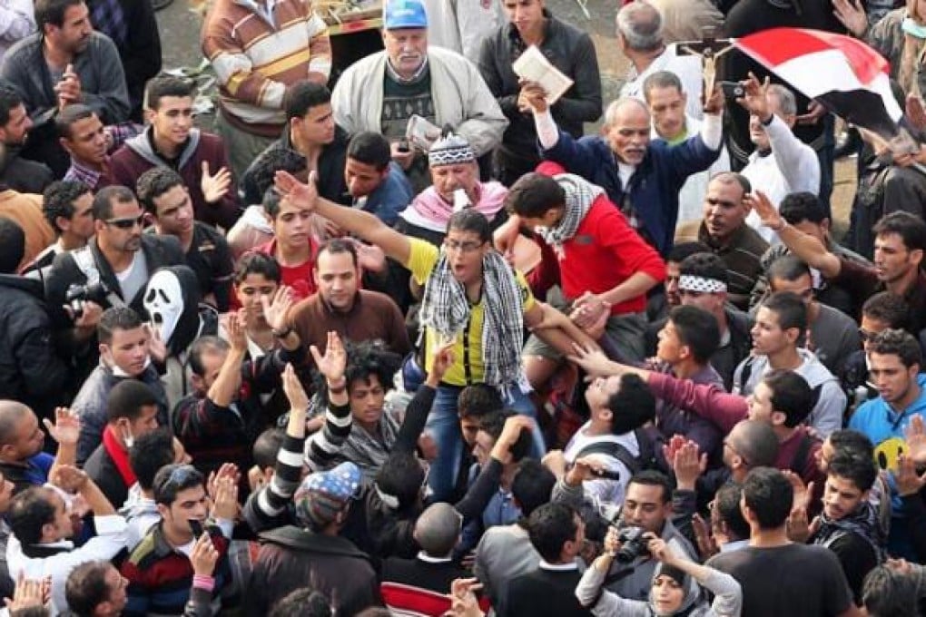 Protesters shout slogans against the President Mohammed Mursi decree at Tahrir Square on Tuesday. Photo: EPA