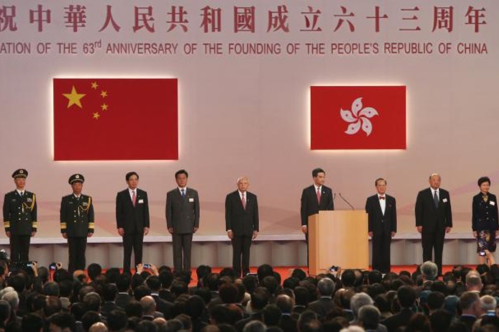 Chief Executive Leung-Chun Ying (at the podium) with other senior government and mainland officials at the National Day Reception at the Grand Hall of the Hong Kong Convention and Exhibition Centre. Photo: SCMP