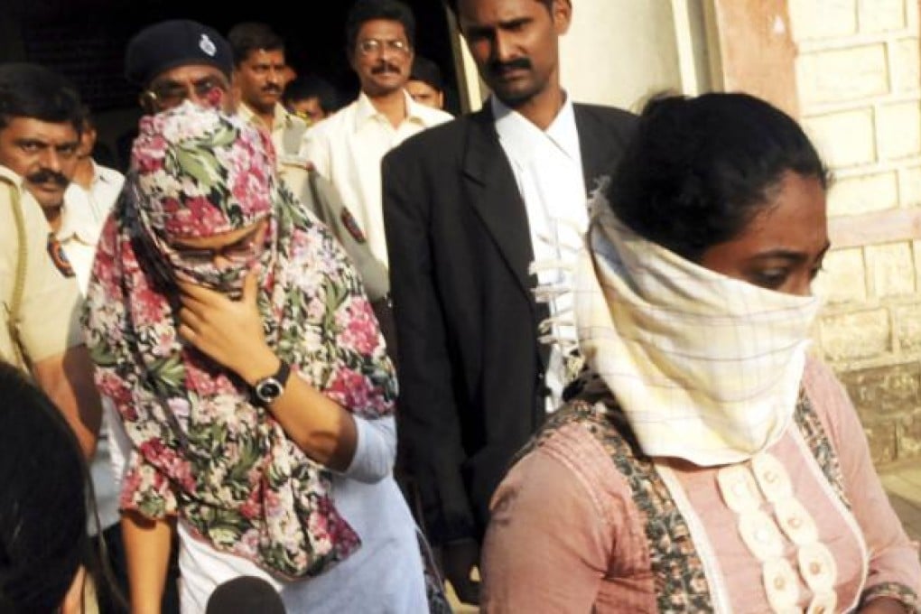 Shaheen Dhada (left) and Renu Srinivas, Indian women arrested for their Facebook posts, come out of a court in Mumbai on November 20. Photo: AP