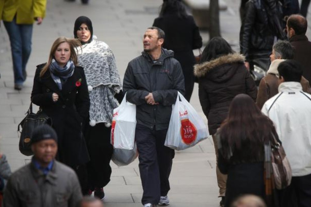 Britain exited a double-dip recession in the third quarter with the strongest growth in five years as Olympic ticket sales and a surge in services helped boost the rebound. Photo: Bloomberg