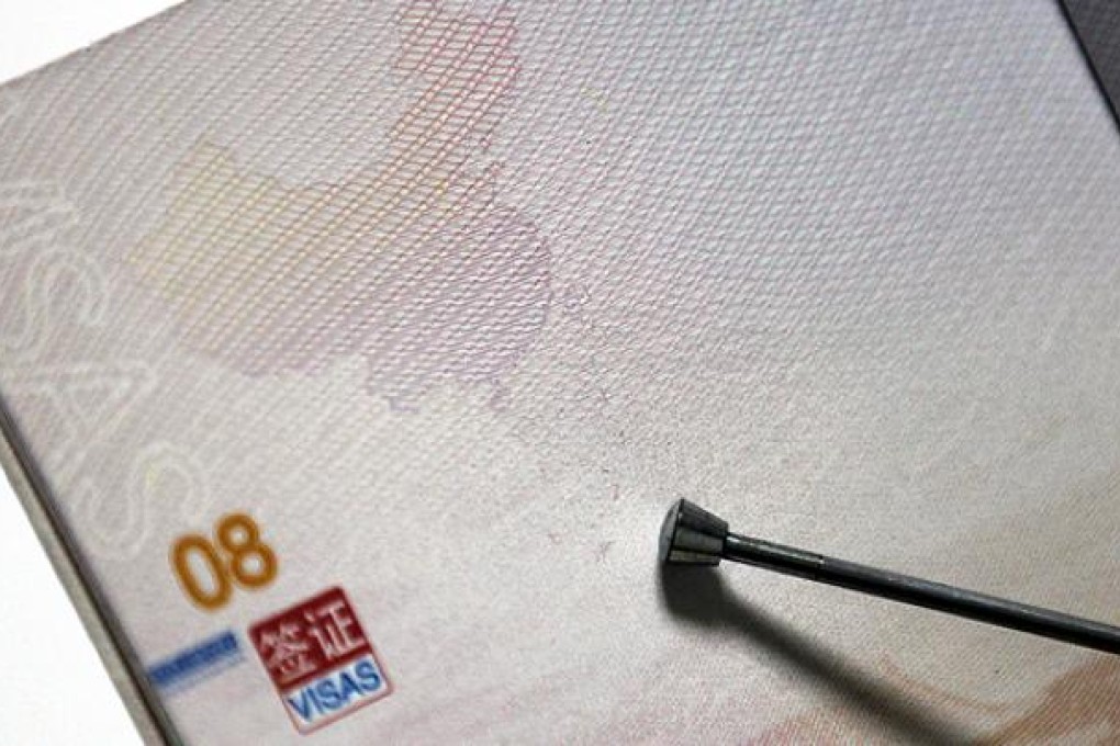 Disputed islands and territorial waters appear on a map of China that includes the South China Sea, printed in new Chinese passports. Photo: EPA