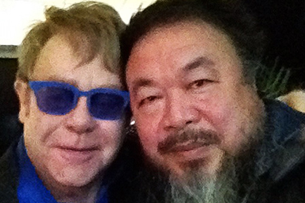 Elton John appears with Ai Weiwei in a photo posted on the artist's Twitter account. Photo: AFP