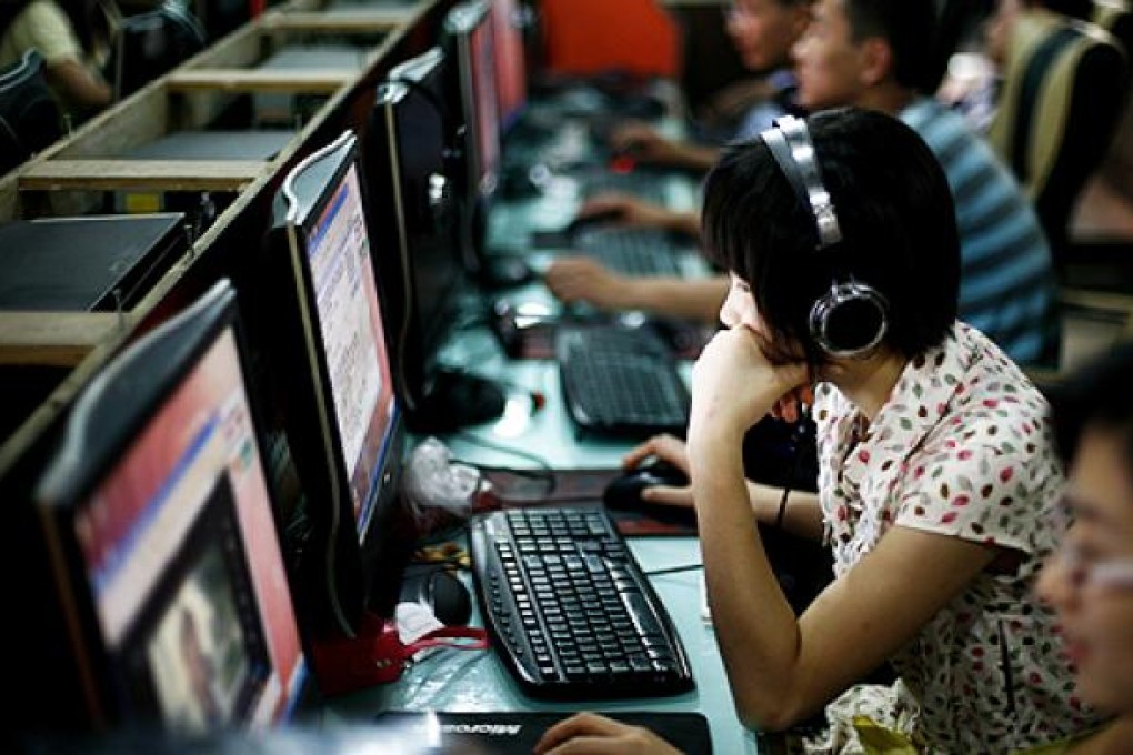 Internet users browse behind China's censorship filter at a cafe in Beijing. Photo: AP