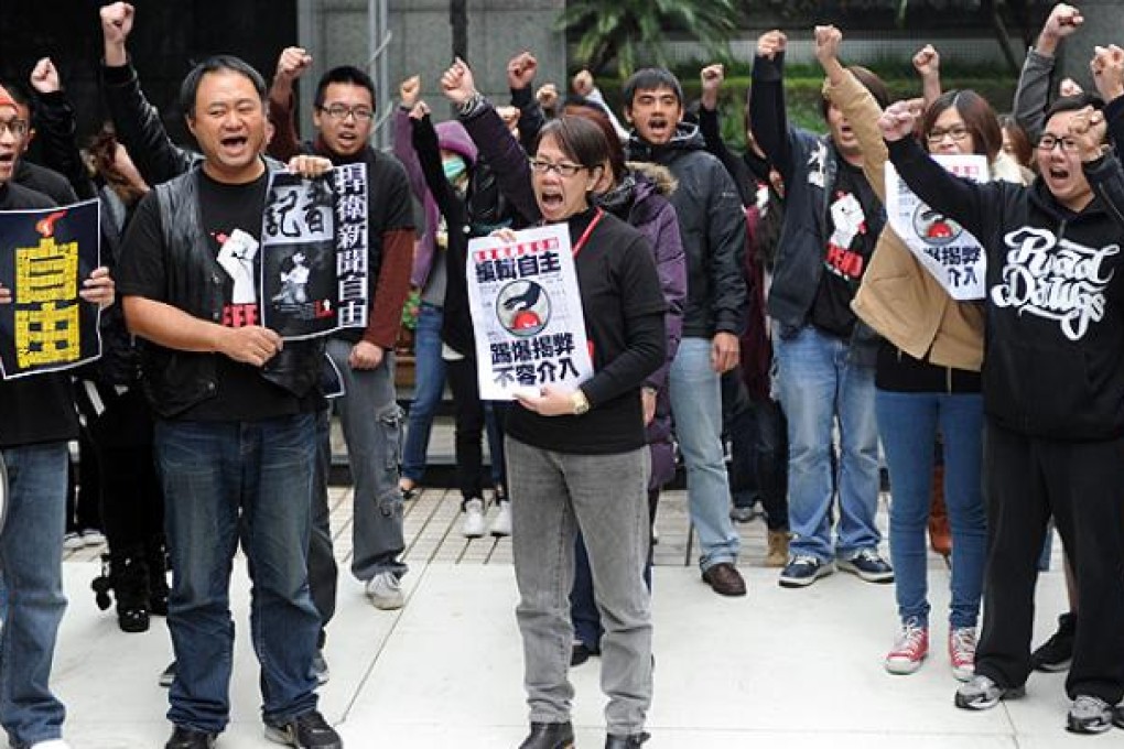 Employees from Taiwan's Next Media protest the sale of Jimmy Lai's Taiwan media assets in Taipei on Tuesday. Photo: AFP