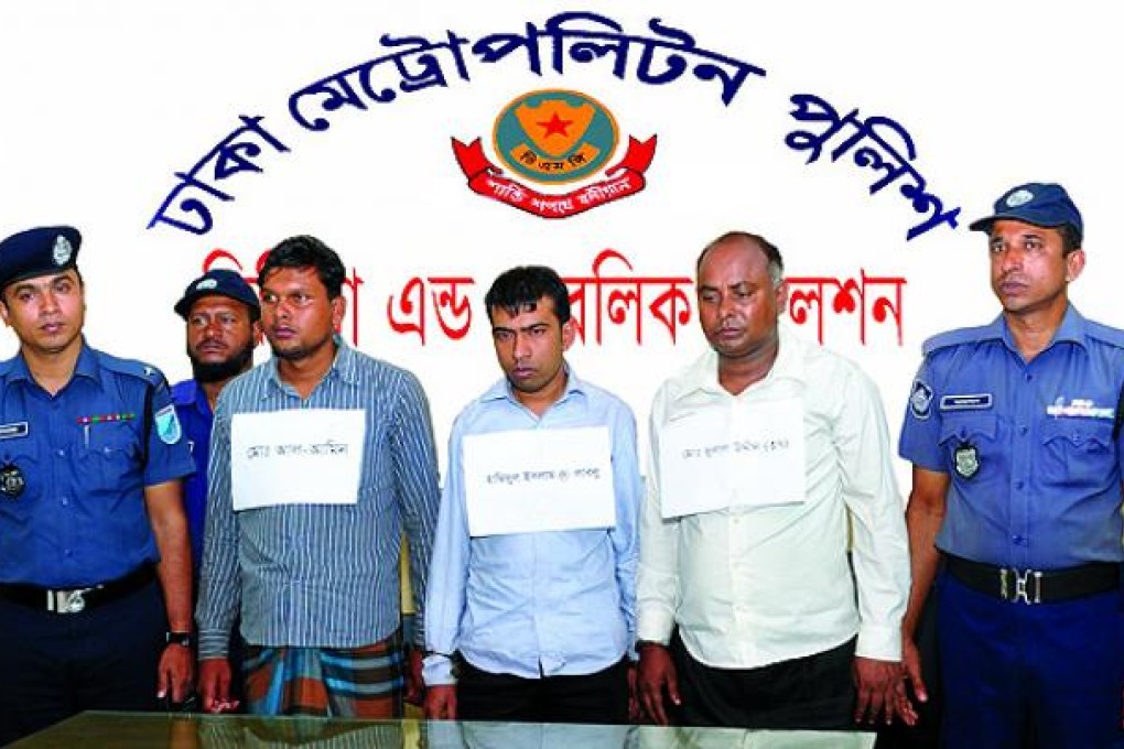 The Dhaka Metropolitan Police parade managers from the Tazreen garment factory arrested in Dhaka. Photo: AFP