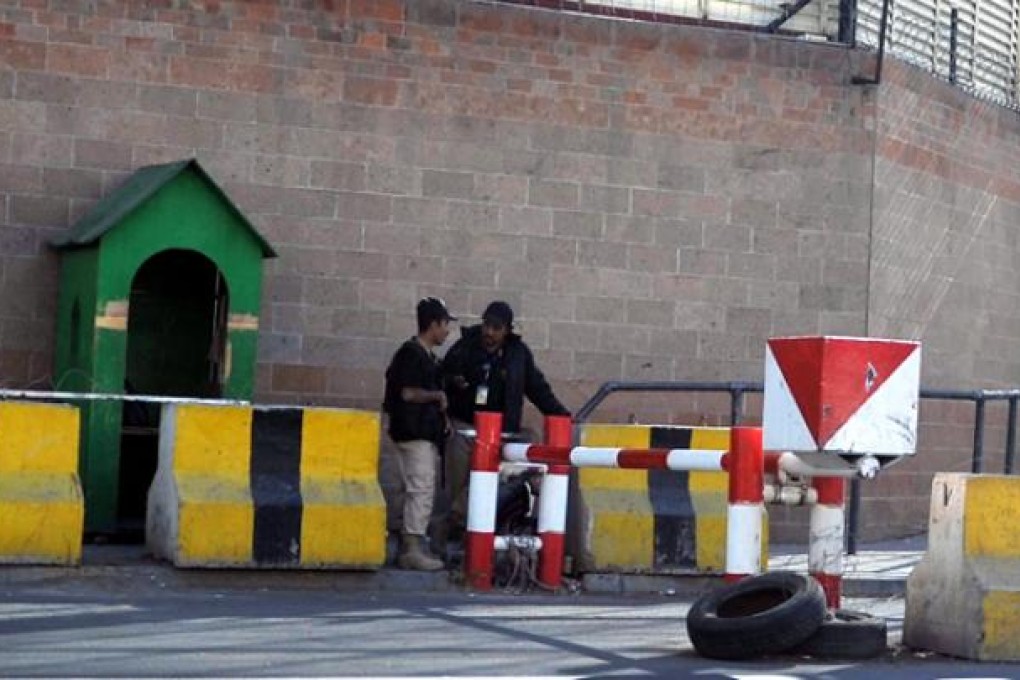 Yemeni soldiers stand guard outside the Saudi embassy in Sanaa, Yemen, on Wednesday. Photo: EPA