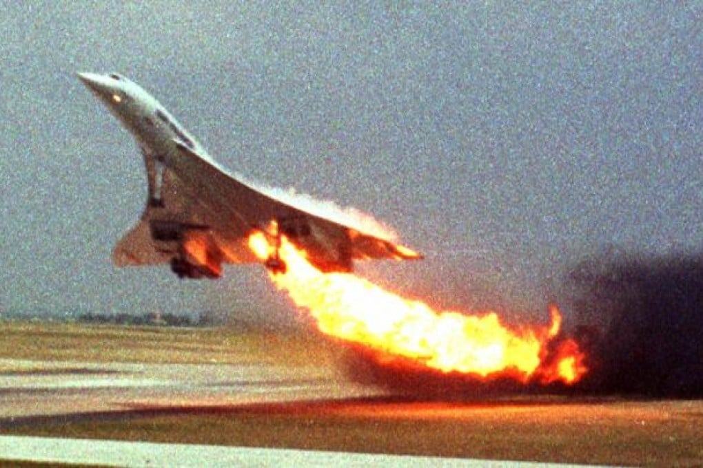 Air France Concorde flight 4590 takes off with fire trailing from its engine on the left wing from Charles de Gaulle airport in Paris on July 25, 2000. The plane crashed shortly after take-off, killing all the 109 people aboard and four others on the ground.