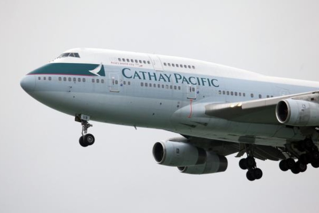 Cathay Pacific Airways will cut passenger capacity 1.6 per cent next year. Photo: Bloomberg