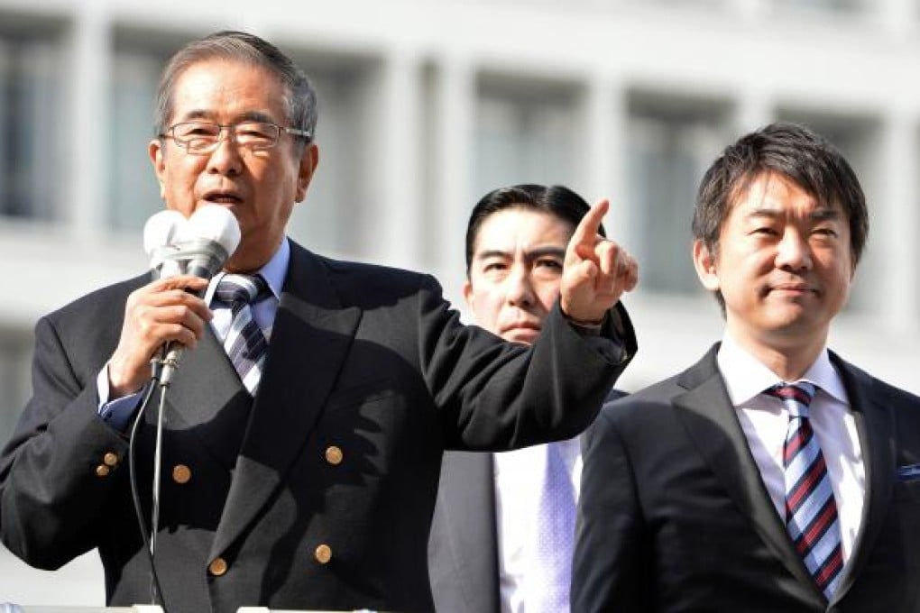 Former Tokyo Governor and Japan Restoration Party leader Shintaro Ishihara (left) delivers a speech, while Osaka Mayor and Japan Restoration Party co-leader Toru Hashimoto (right) looks on. Photo: AFP