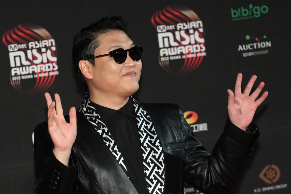 South Korean pop singer Psy poses on the red carpet as he attends the Mnet Asian Music Awards in Wan Chai. Photo: Felix Wong