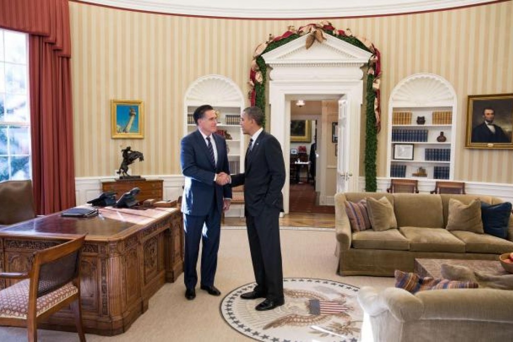 Victor and vanquished share a cordial handshake. Photo: AFP