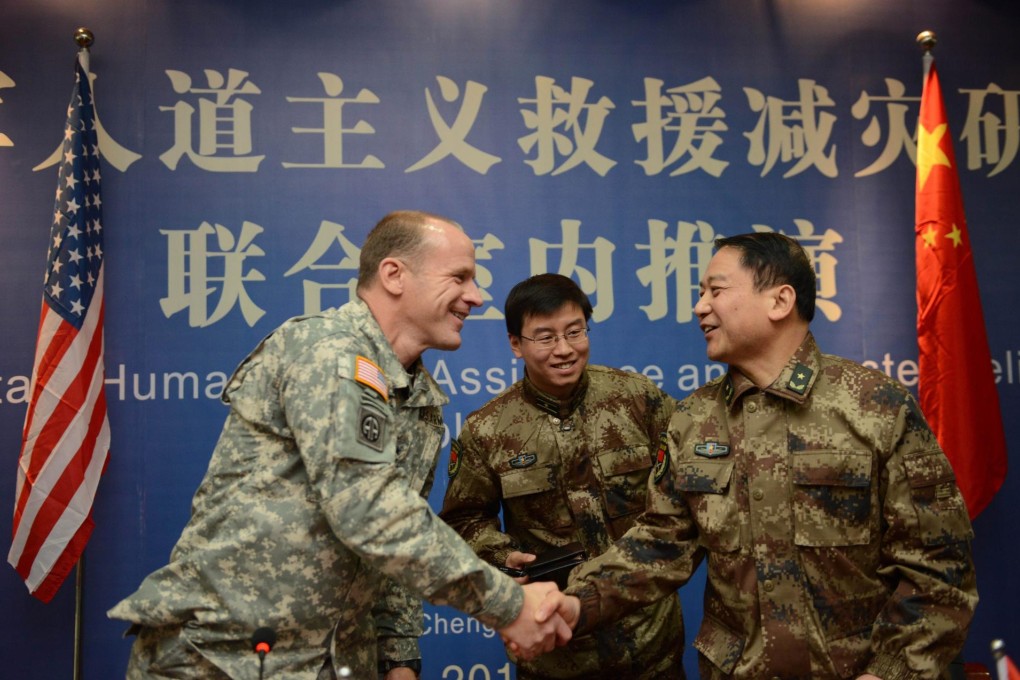 Major General Stephen Lyons shakes hands with Major Tang Fen of the People's Liberation Army after the Chengdu exercise. Photo: EPA