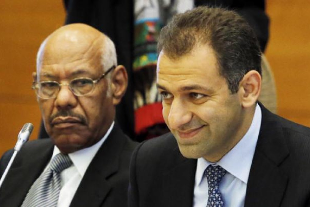 Abrahim Miro from the Syrian Economic Task Force (right) along with Arab League Ambassador El Hassan Shabbo Mohamed attends the international meeting to coordinate sanctions on the government of Syrian President Bashar Assad in Tokyo on Friday. Photo: AP