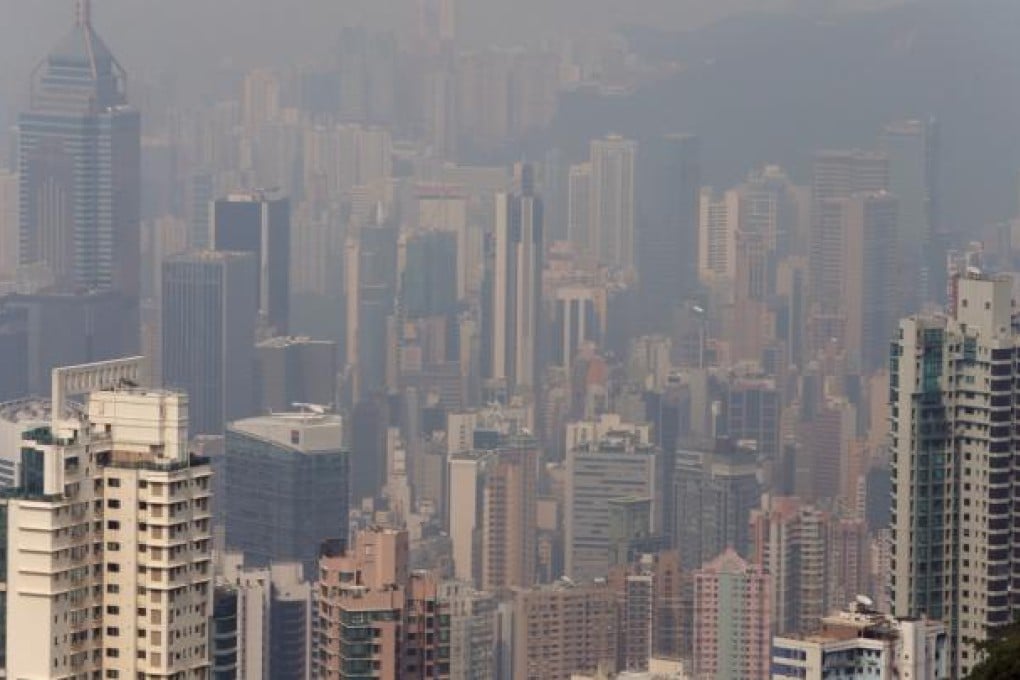 The Hong Kong skyline is hazed by smog. Pictured at The Peak. Photo: Sam Tsang