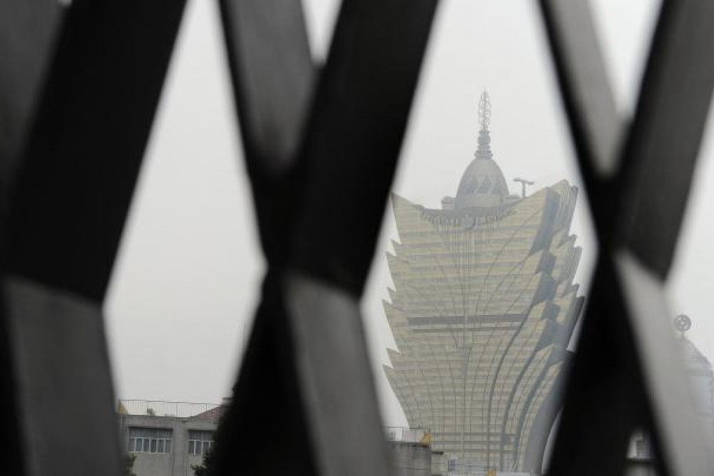 The Grand Lisboa seen through the gates of the Ruins of St Paul's. More than half of visitors in September did not stay overnight. Photo: AFP