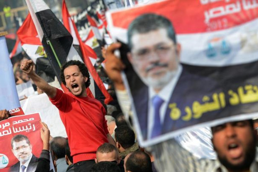 Passionate supporters of President Mohamed Mursi gathered in front of Cairo University to have their say. Photo: AFP