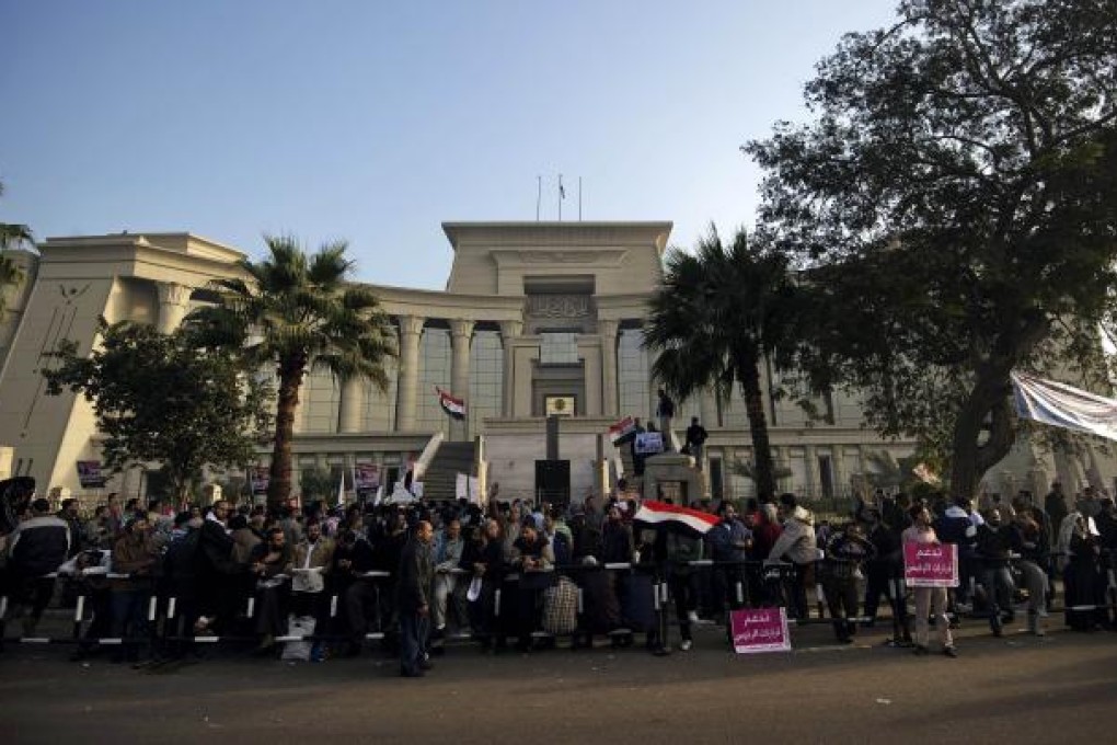 Hundreds of supporters of Egypt's President Mohamed Mursi protest outside the Supreme Constitutional Court in Cairo on Sunday. Photo: AFP