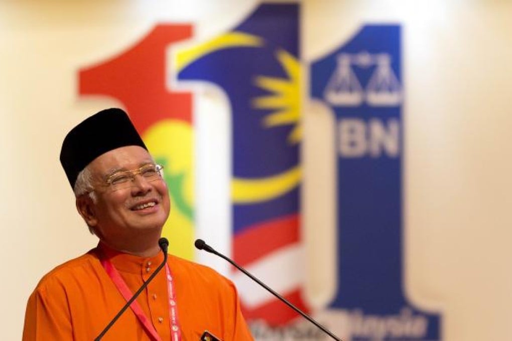 Malaysia's Prime Minister Najib Razak gestures during his speech at the United Malays National Organisation (UMNO) annual general assembly. Photo: AFP