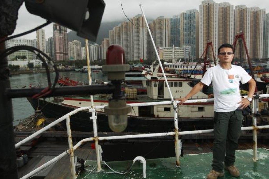 Liu Peiwen, seen here on the Kai Fung No 2 in Aberdeen harbour, walked 3,000km from Wuhan to Hong Kong to arouse national awareness for the Diaoyu Islands. Photo: Sam Tsang