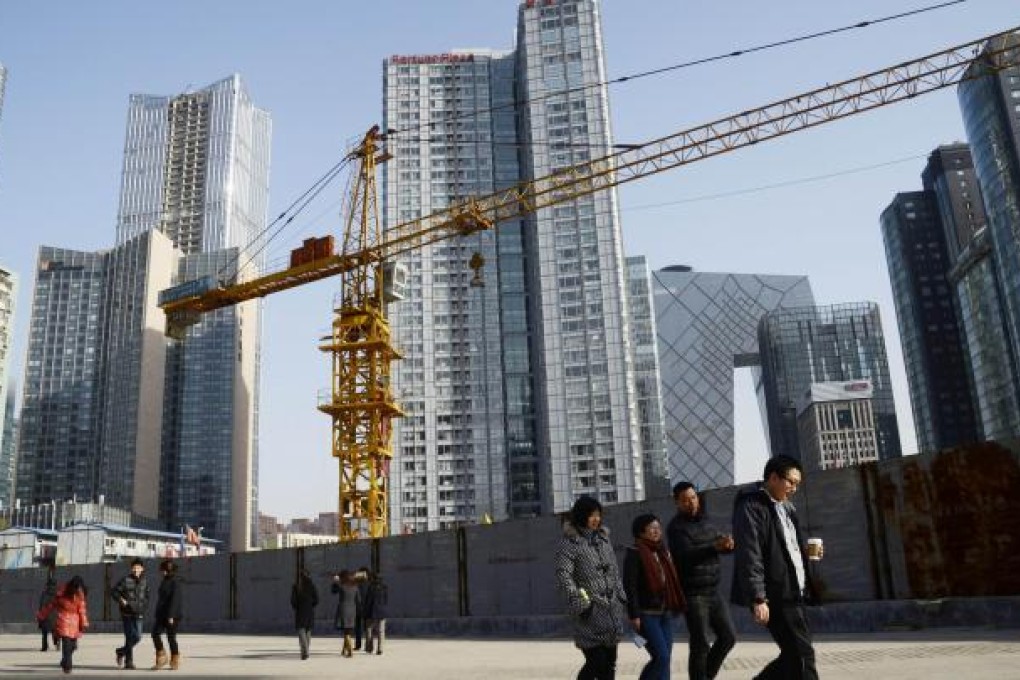 Construction work progresses in a central business district in Beijing, as the country's economy continues to develop. Photo: AFP