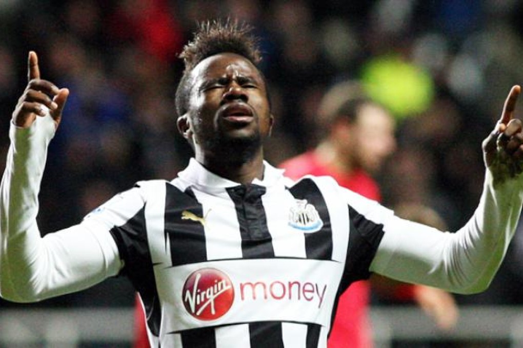 Newcastle United's Gael Bigirimana celebrates his goal during their English Premier League soccer match against Wigan Athletic at St James' Park on Monday. Photo: AP