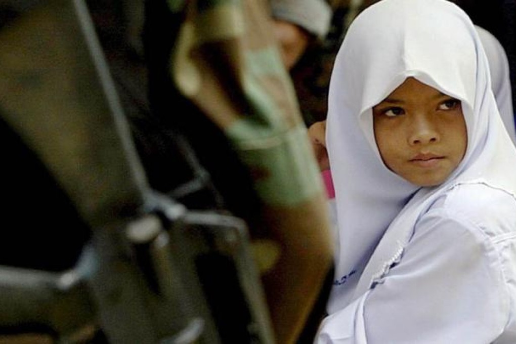 Nearly 60 children aged 15 or under have lost their lives as a result of the Thai insurgency. Photo: AFP