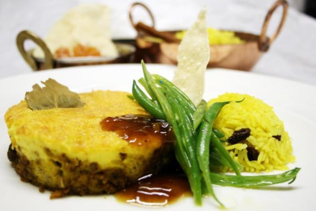Bobotie, a curried beef dish topped with egg custard, is likely to have originated in Jakarta. Photo: Mount Nelson hotel