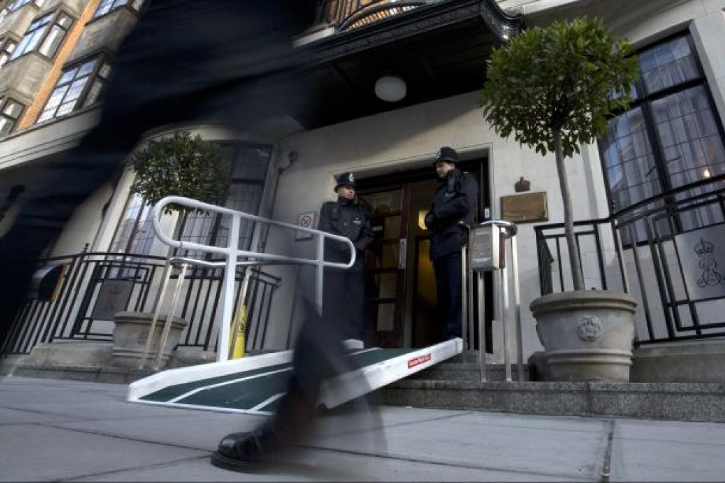 Two policemen stand guard outside the King Edward VII hospital where Kate Duchess of Cambridge is receiving treatment in central London. Photo: AP