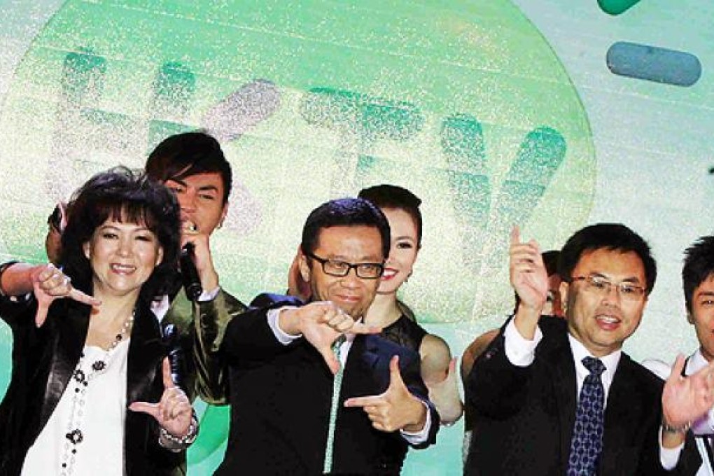 (Left to right) To Wai-bing, chief executive of City Telecom, chairman Ricky Wong Wai-kay and vice-chairman Paul Cheung Chi-kin attend a function in Tsim Sha Tsui on Tuesday. Photo: David Wong
