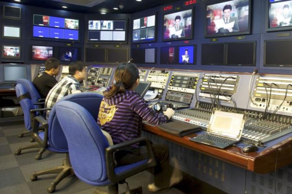 Staff at work in studio of CNC TV Station of Xinhua News Agency. Photo: Ricky Wong