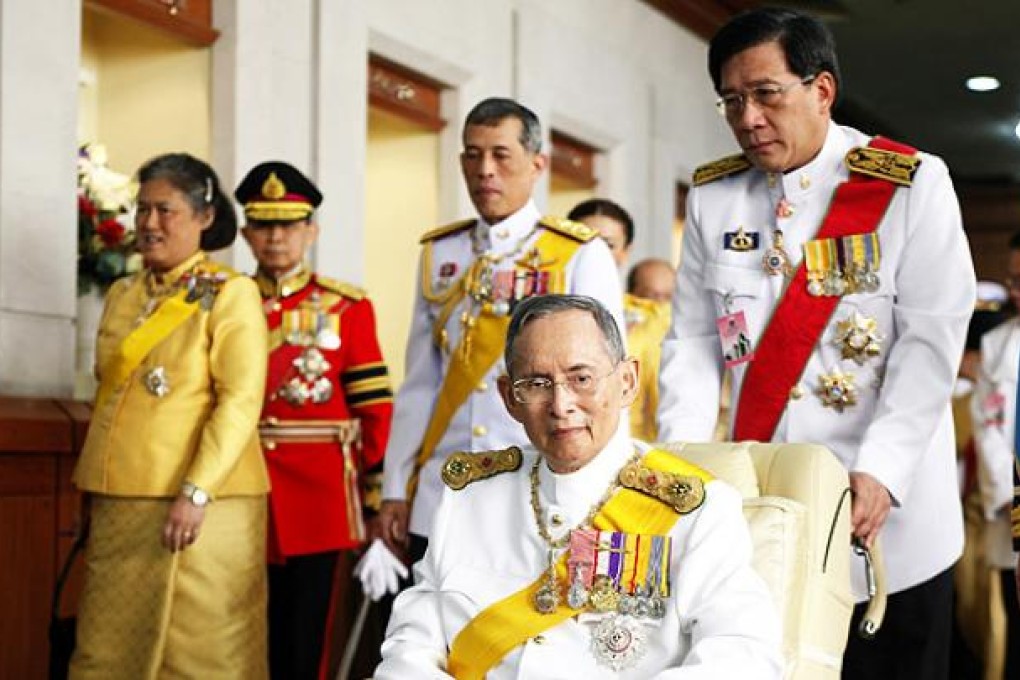 Thai King Bhumibol Adulyadej departs Siriraj hospital to grant an audience on his 85th birthday celebrations in Bangkok on Wednesday. Photo: EPA