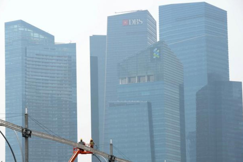 Higher prices are pressuring wages in Singapore. Photo: AFP