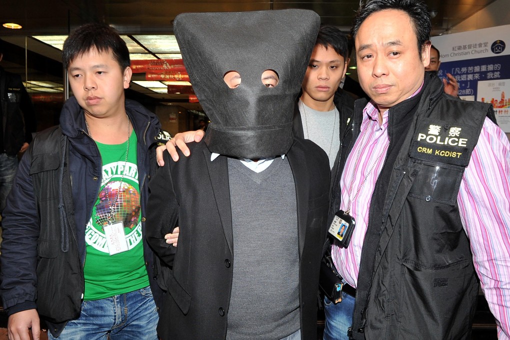 Police take John Yan to his Hung Hom office. Photo: SCMP