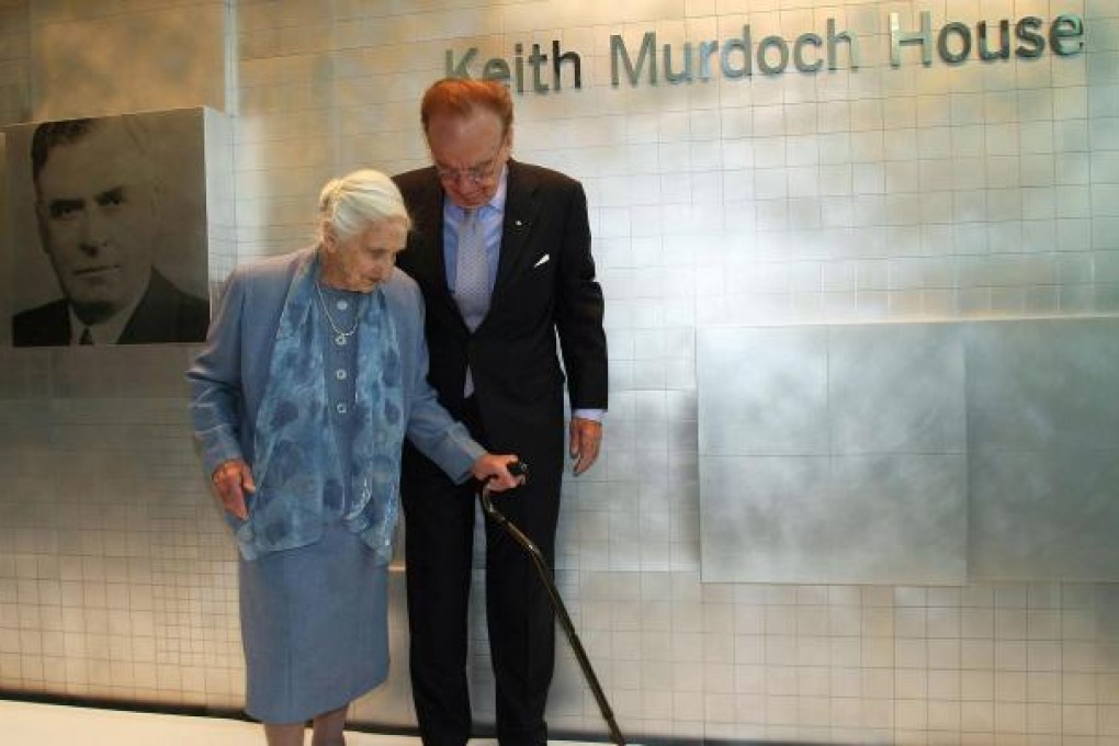 Rupert Murdoch aids his mother, Dame Elisabeth Murdoch. Photo: AP