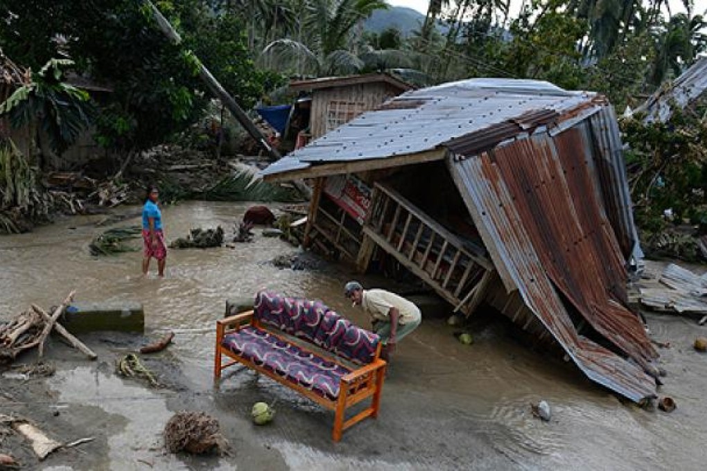 Typhoon Bopha leaves a home wrecked in New Bataan town in the southern Philippines. Photo: AFP