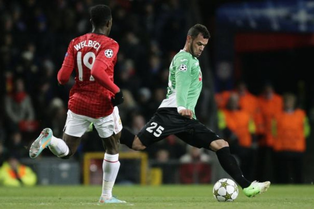 Cluj's Luis Alberto, right, keeps the ball away from Manchester United's Danny Welbeck. Photo: AP