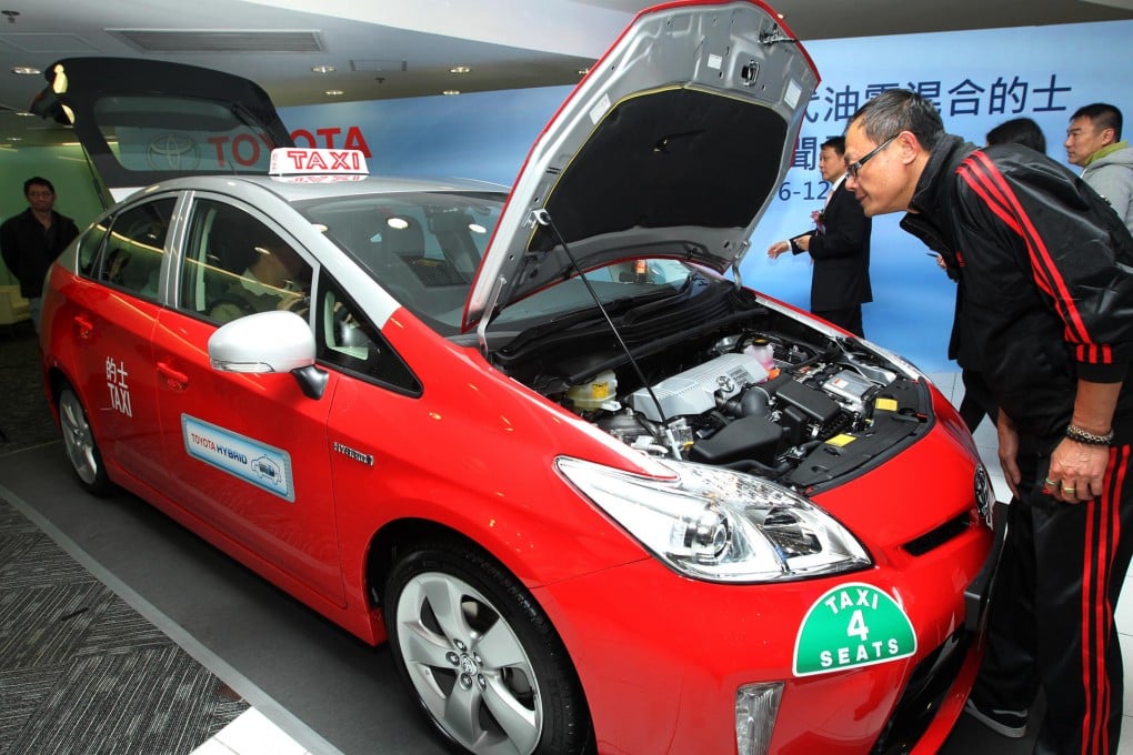 A Toyota New Generation Hybrid Taxi is unveiled at the company's Kowloon Bay main branch yesterday. Photo: Dickson Lee
