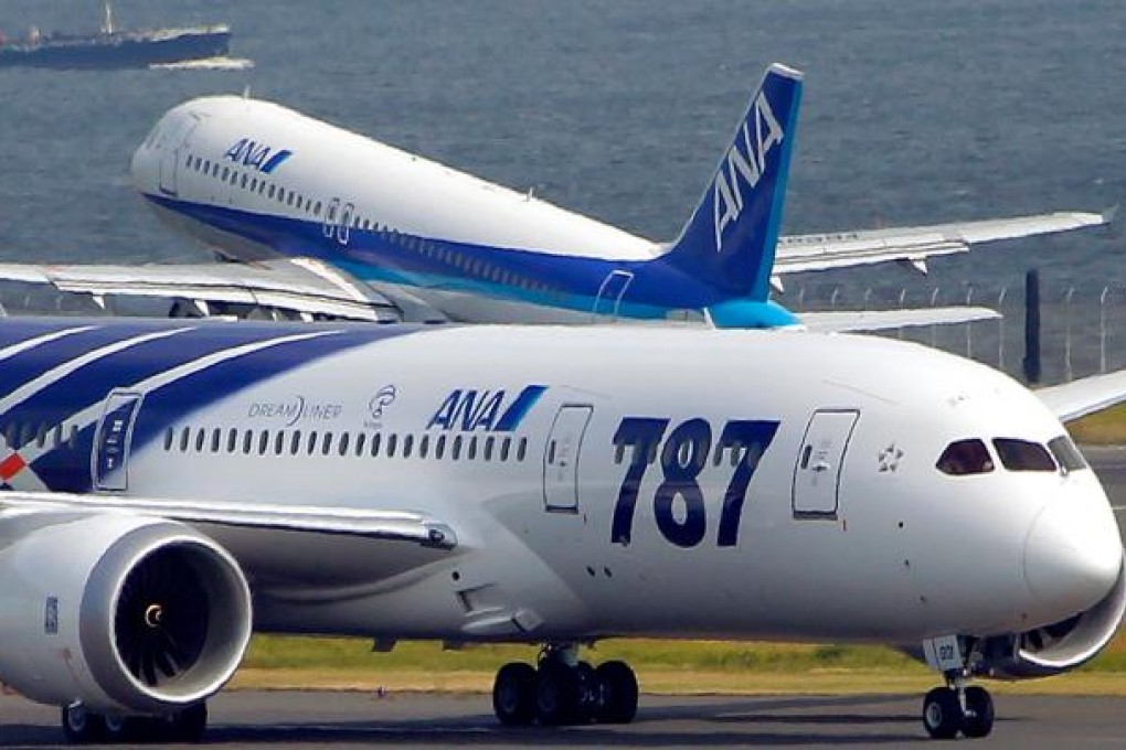 A Boeing 787 plane lands at Tokyo’s international airport. Boeing and its engineers unions have shelved talks for the rest of the year. Photo: AP
