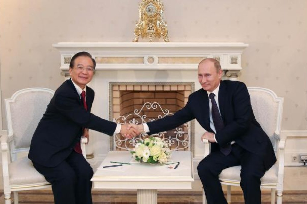 Premier Wen Jiabao meets President Putin. Photo: Xinhua