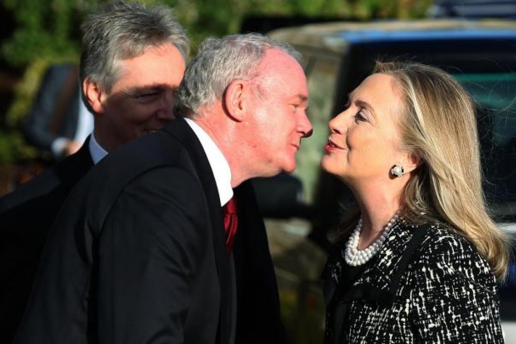 Northern Ireland's Deputy First Minister Martin McGuinness greets Hillary Rodham Clinton.