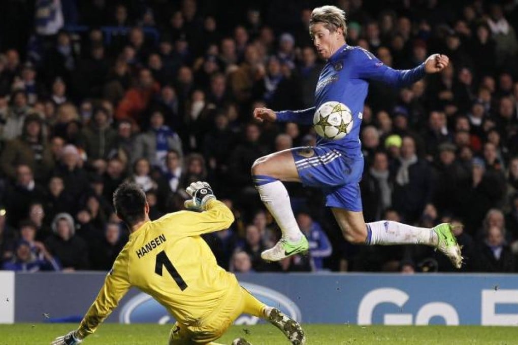Torres goes around FC Nordsjaelland's Danish goalkeeper Jesper Hansen to score during their Champions League match. Photo: AFP