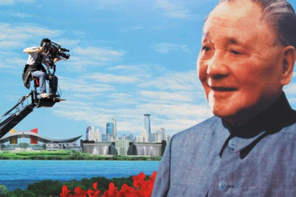 A billboard of former leader Deng Xiaoping overlooks Shenzhen. Photo: Dickson Lee