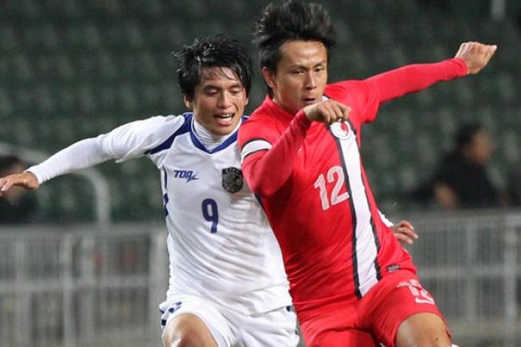 Hong Kong's Lo Kwan-Yee and Taiwan's Lo Chih-an in action during the hosts' 2-0 win at Hong Kong Stadium last night. Photo: Dickson Lee