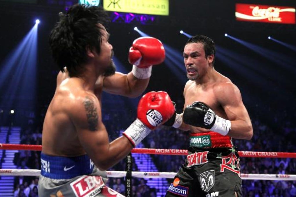 Juan Manuel Marquez ended the fight with an overhand right that hit the advancing Manny Pacquiao flush, sending him down hard. Photo: AFP