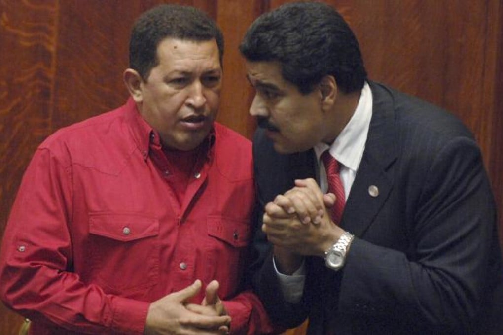 Nicolas Maduro (right) with mentor Hugo Chavez. Photo: AP